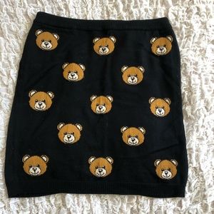 MOSCHINO mini knitted skirts with bear print.